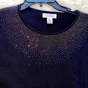 Black Calvin Klein sweater with rhinestones at the neck area